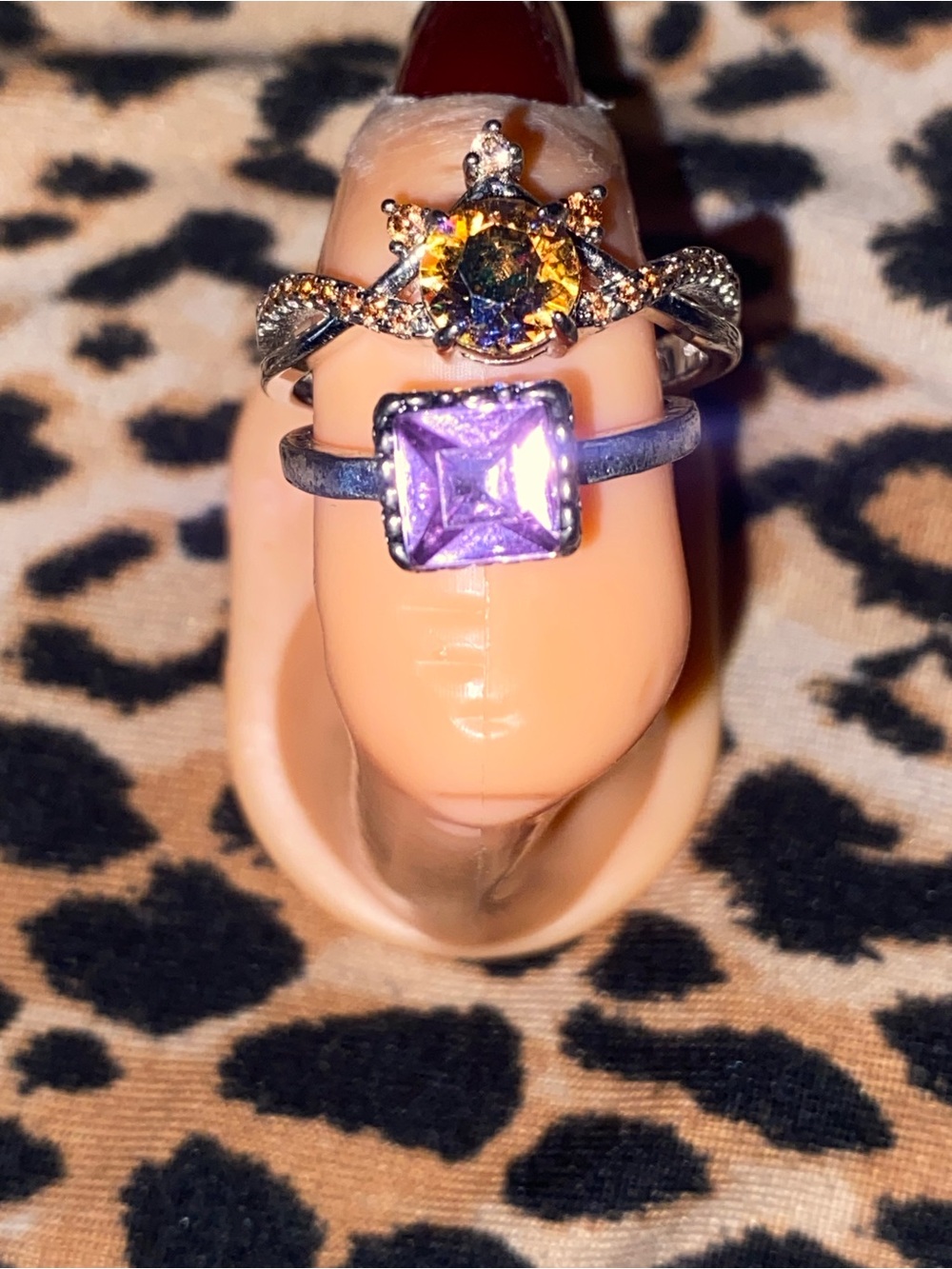 Purple square gemstone ring and a circle yellow ring